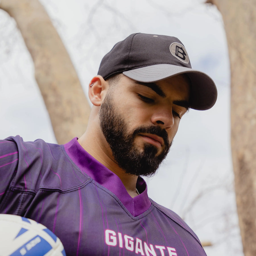 A photo of someone outside wearing a Big Bear Headwear baseball hat. This baseball hat is made for people with big heads. If you've got a big head (XXL head) then you need one of our hats. 