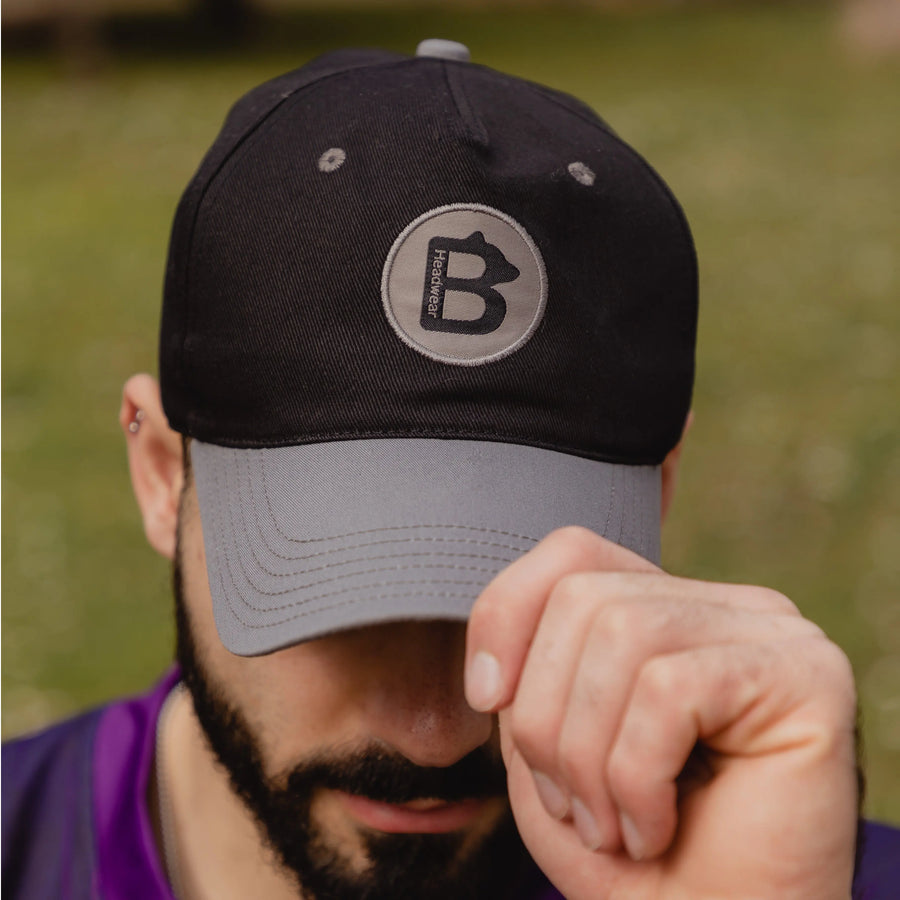 A photo of someone wearing a Big Bear Headwear baseball hat. This baseball hat is made for people with big heads. If you've got a big head (XXL head) then you need one of our hats. 